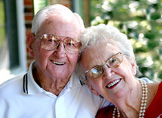 Photo of a couple smiling.